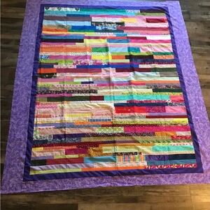 Colorful Scrappy. Quilt Too with Purple Border NOT A QUILT YET  72” X 82”